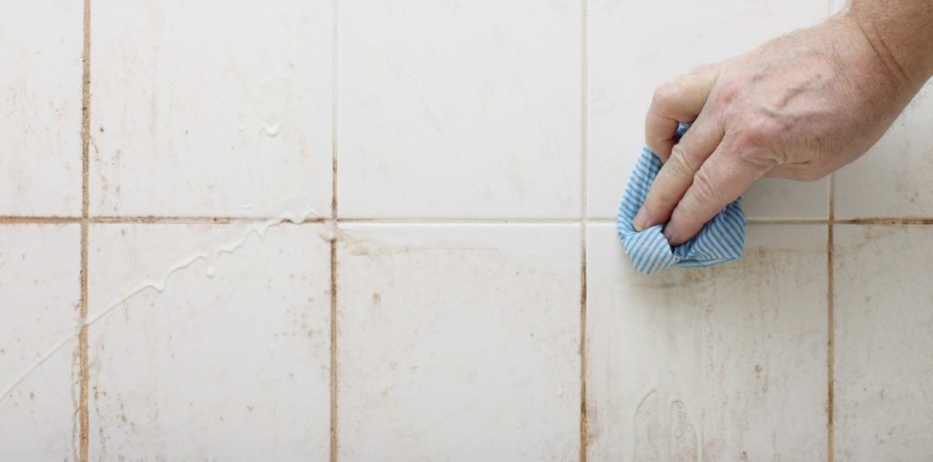 Clean the shower tile and grout