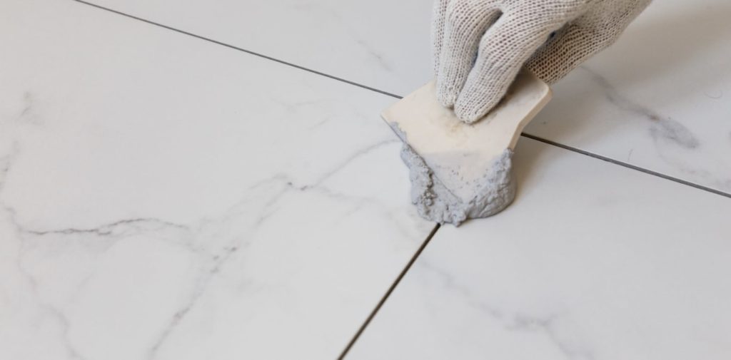 Apply the baking soda paste onto the grout