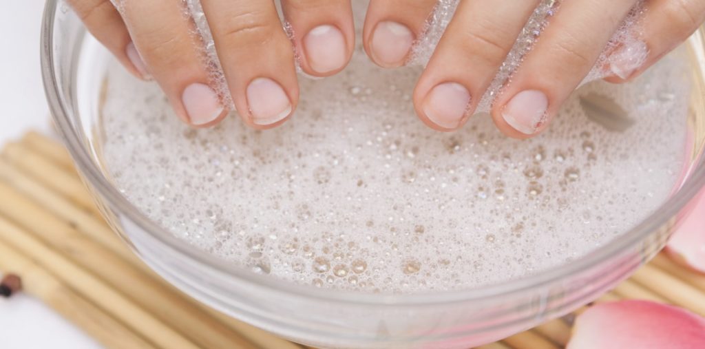 Dip nails in dish soap solution