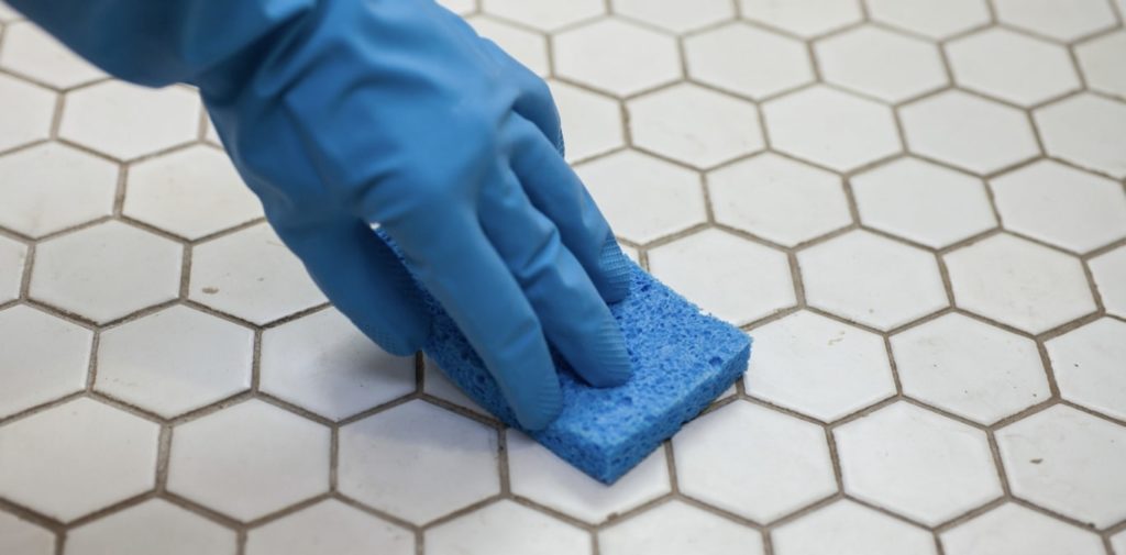 Do I have to get a pro to clean white grout
