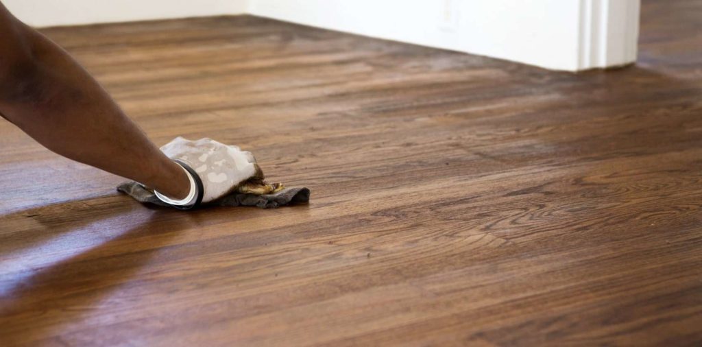 What to do first if a wood surface is spilled on